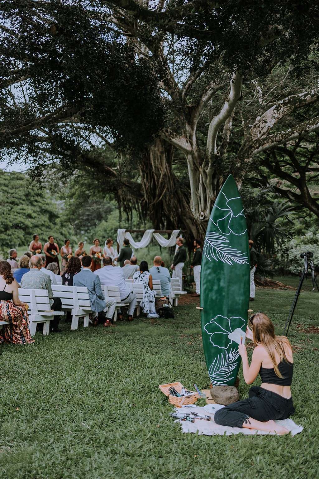 Outdoor wedding ceremony beneath a banyan tree at Waimea
