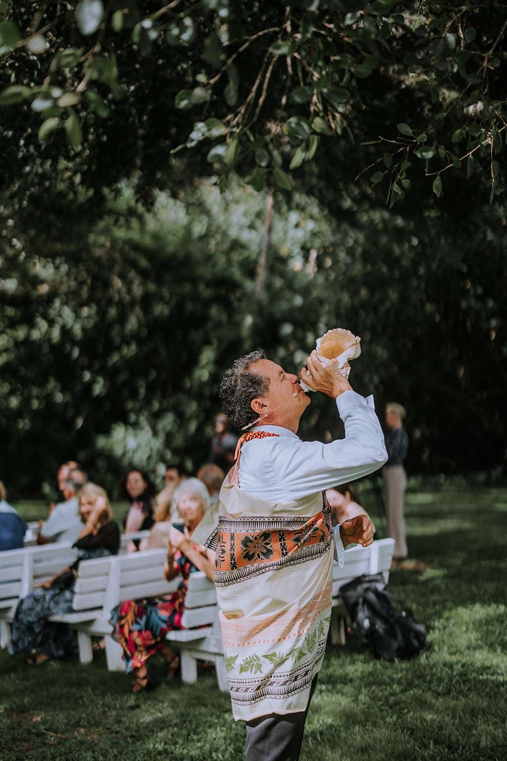 Ceremonial conch shell blessing at an Oʻahu wedding